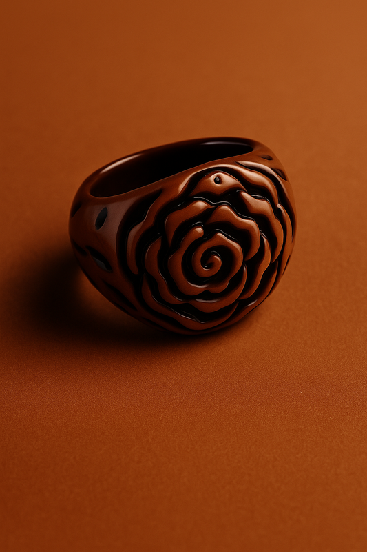 Decorative ring with intricate design on a brown background