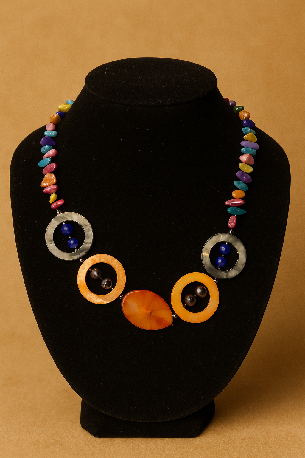 Colorful necklace on a black mannequin bust against a beige background
