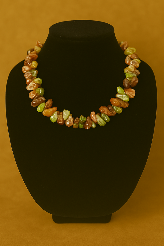 Necklace with multicolored stones on a black mannequin against a brown background